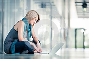 Pretty young female student on college/university campus