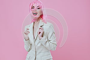 Pretty young female in White blazer pink hair Glamor Cosmetics color background unaltered