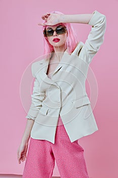 Pretty young female in White blazer pink hair Glamor Cosmetics color background unaltered