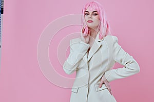 Pretty young female in White blazer pink hair Glamor Cosmetics color background unaltered