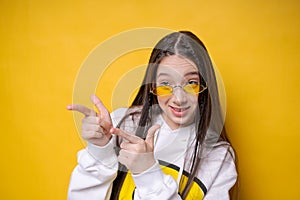 Pretty young girl brunette girl in casual white plumpness, glasses posing