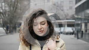 Pretty young girl face on a city street