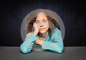 Pretty Young Girl with Head Resting on Hand