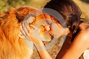 Pretty young girl kisses her cute dog