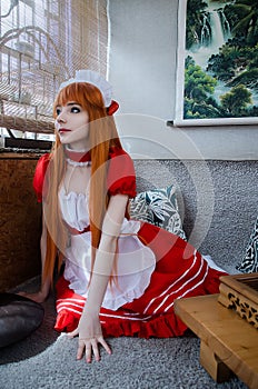 Pretty young girl servant costume portrait dressed in red