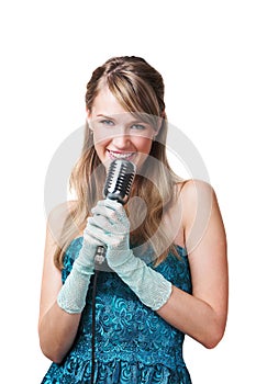 Pretty young girl singing into retro microphone