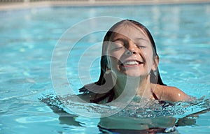 Pretty young girl in a swimming pool