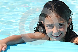 Pretty young girl in a swimming pool