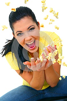 Pretty Young Girl Throwing Popcorn