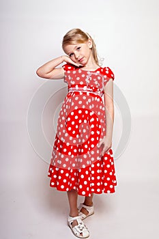 Pretty young kid girl  in red dress with gift box