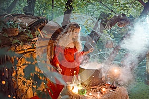 Pretty young lady with blond curly hair above big magic cauldron with smoke and bottles with liquids, forest nymph in