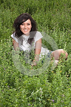 Pretty young lady on a meadow