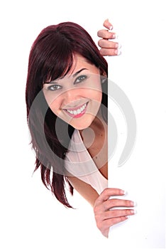 Pretty Young Lady Smiling while holding White Board