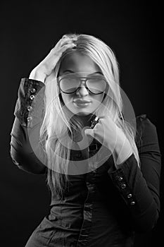 Pretty young lady with straight hair in eyewear and blouse