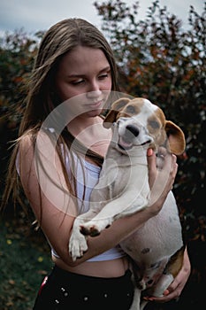 Pretty and young model with her dog