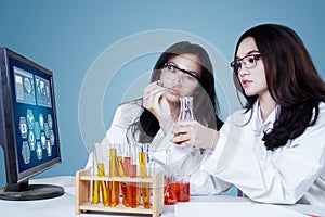 Pretty young scientists working in the lab