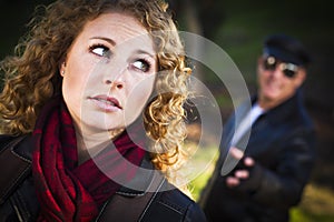 Pretty Young Teen Girl with Man Lurking Behind Her