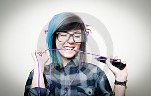 Pretty young teen woman happy while listening music