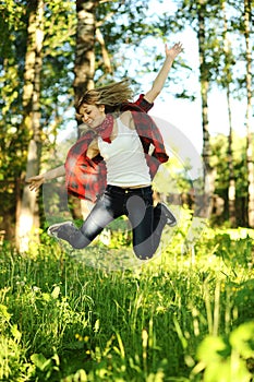 Pretty young teen woman jumping