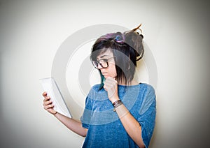 Pretty young teen woman using tablet