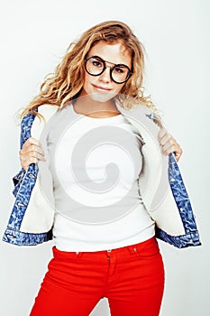 Pretty young teenage girl blond curly hipster fashion glasses emotional posing happy smiling on white background