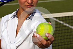 Pretty young tennis player woman playing tennis