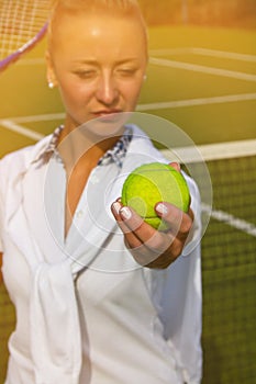 Pretty young tennis player woman playing tennis