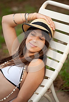 Pretty Young Woman in Bathing Suit and Hat