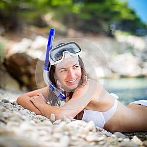 Pretty, young woman on a beach