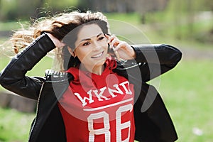 Pretty young woman with beautiful smile talking on mobile phone. Happy girl.