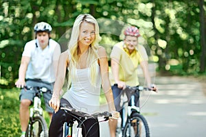 Pretty young woman with bicycle