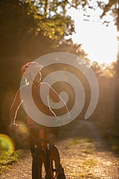 Pretty, young woman biking on a mountain bike