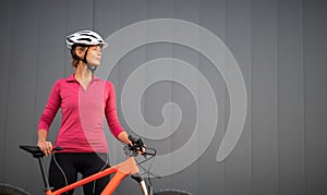 Pretty, young woman biking on a mountain bike