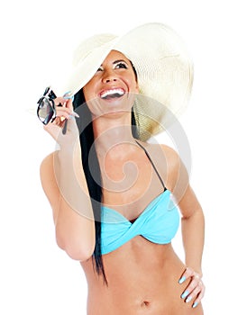 Pretty young woman in bikini and straw hat.