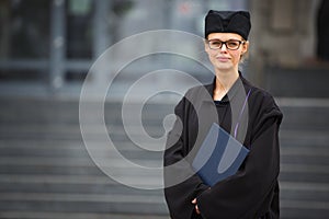 Pretty, young woman celebrating joyfully her graduation