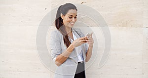 Pretty young woman checking her mobile phone