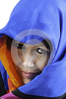 Pretty young woman covering her head with a scarf
