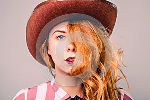 Pretty young woman in cowboy hat with golden hair