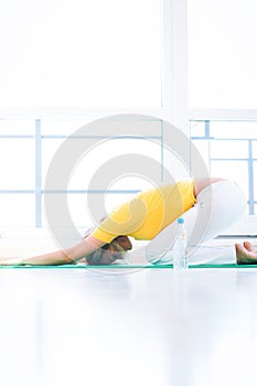 Pretty young woman doing YOGA exercise