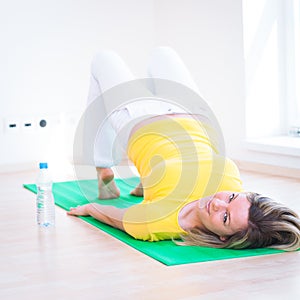 Pretty young woman doing YOGA exercise