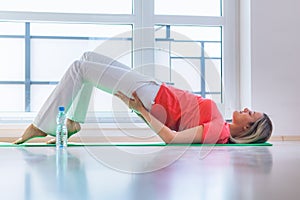 Pretty young woman doing YOGA exercise