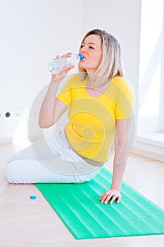 Pretty young woman doing YOGA exercise