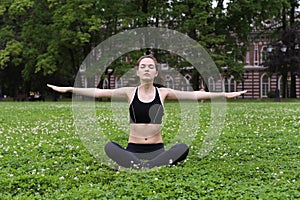 Pretty young woman doing yoga.