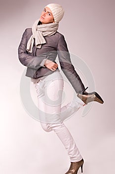 Pretty young woman dressed winter style clothes