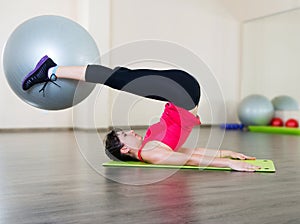 Young woman fitness workout in gym with fitball photo