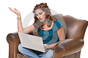 Pretty young woman frustrated with computer