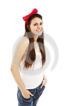 Pretty young woman with hands in pockets