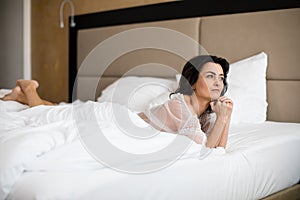 Pretty, young woman in her bed