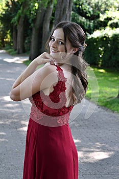 Pretty young woman in her first beautiful ballgown