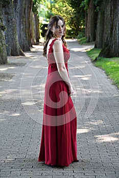 Pretty young woman in her first beautiful ballgown